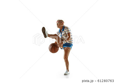 Senior woman playing basketball in sportwear on white background Senior woman playing basketball in sportwear on white background 61280763