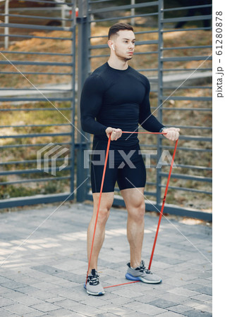 Handsome man training in a summer park 61280878