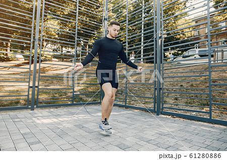 Handsome man training in a summer park 61280886