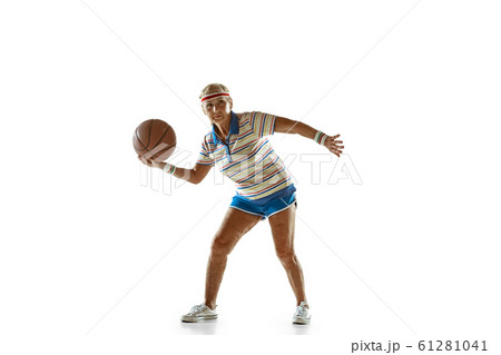 Senior woman playing basketball in sportwear on white background 61281041