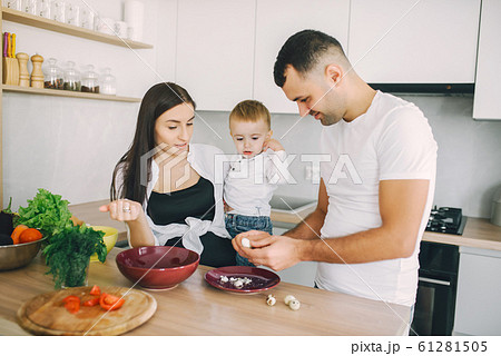 Family prepare the salad in a kitchen Family prepare the salad in a kitchen 61281505