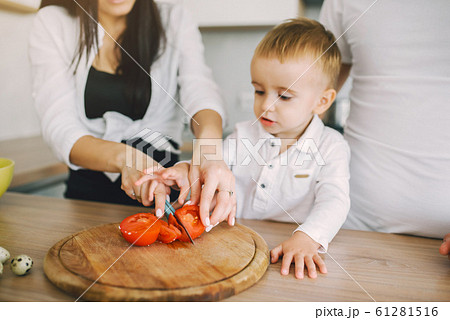 Family prepare the salad in a kitchen Family prepare the salad in a kitchen 61281516