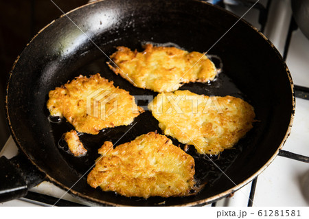 potato pancakes on pan potato pancakes on pan 61281581