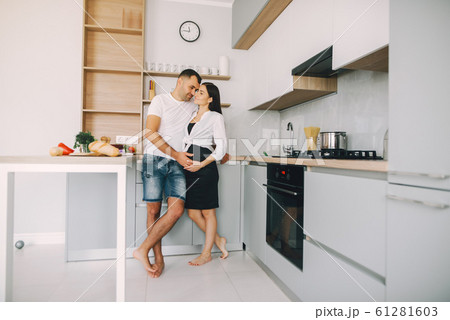 Family prepare the salad in a kitchen Family prepare the salad in a kitchen 61281603
