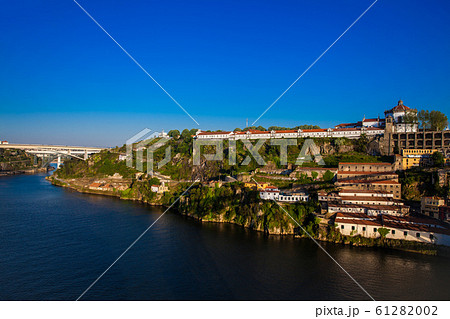 View of the Duoro River in a beautiful early spring day at Porto City in Portugal 61282002