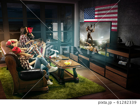 Group of friends watching TV, american football championship Group of friends watching TV, american football championship 61282339