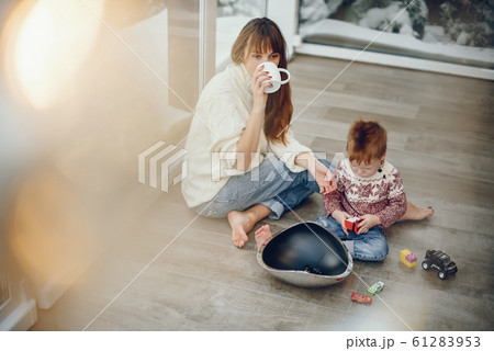 Family spending time at home in a christmas decorations 61283953