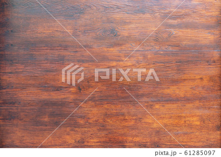Warm wooden texture. Brown wooden background. Warm wooden texture. Brown wooden background. 61285097