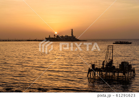 Haji Ali Dargah mosque and tomb on sunset. Mumbai. Haji Ali Dargah mosque and tomb on sunset. Mumbai. 61291623
