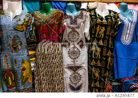 EDFU, EGYPT 19.05.2018 Traditional egyptian colorful palatine and clothes sold at open air market in Edfu Horus Temple EDFU, EGYPT 19.05.2018 Traditional egyptian colorful palatine and clothes sold at open air market in Edfu Horus Temple 61295877