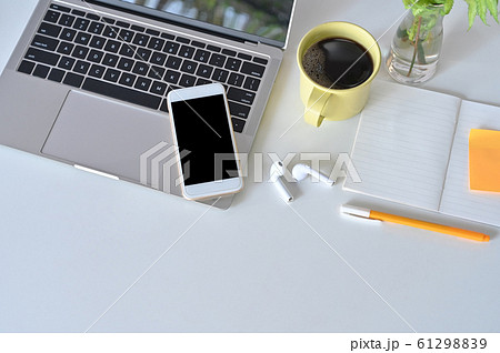 Mockup smartphone, laptop, earphone on office desk. Mockup smartphone, laptop, earphone on office desk. 61298839