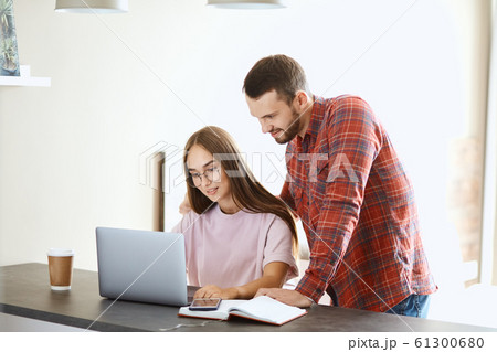 Young couple spends time near computer screen Young couple spends time near computer screen 61300680