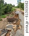 Collapse of the paved road in the forest 61303082