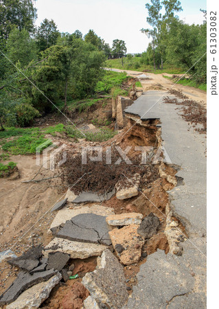 Collapse of the paved road in the forest Collapse of the paved road in the forest 61303082