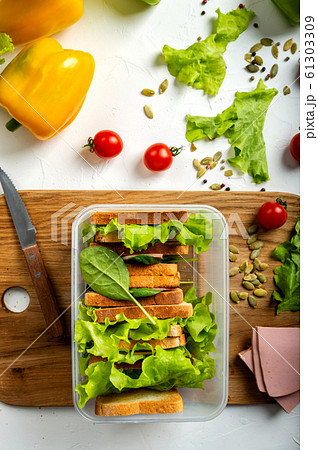 School lunch. Food Box with a delicious sandwich. Top view. 61303309