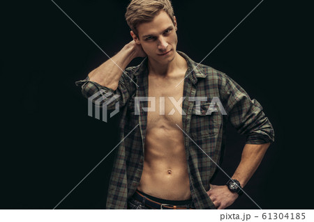 Portrait of a beautiful athletic man in checkered shirt with naked torso Portrait of a beautiful athletic man in checkered shirt with naked torso 61304185