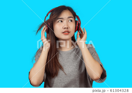 young woman wearing headset enjoying new audio 61304328