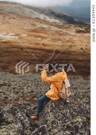 young motivated tourist taking off his hat 61304445