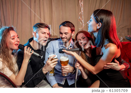 communicable friends in karaoke bar communicable friends in karaoke bar 61305709