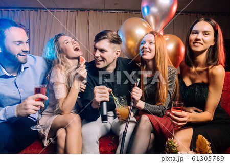 young clubbers spend time in karaoke bar young clubbers spend time in karaoke bar 61305789
