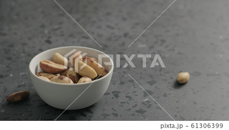 brazil nuts in white bowl on terrazzo countertop brazil nuts in white bowl on terrazzo countertop 61306399