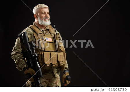 Old military officer holding sniper rifle. Old military officer holding sniper rifle. 61308739