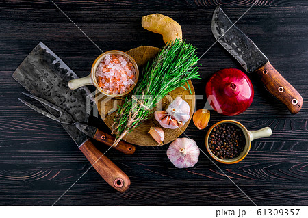 Overhead view of rustic butcher set and spice Overhead view of rustic butcher set and spice 61309357