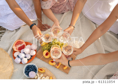 The company of female friends enjoys a summer The company of female friends enjoys a summer 61311054