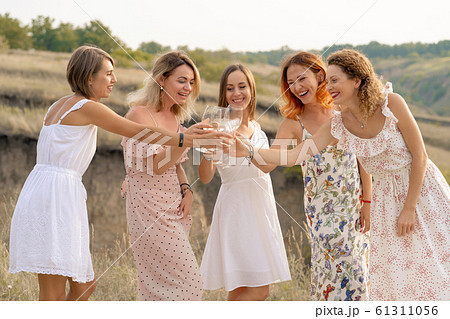The company of female friends enjoys a summer 61311056
