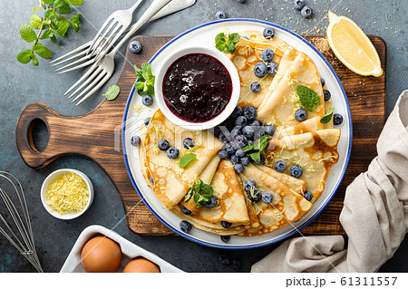 Crepes, thin pancakes with blueberry jam and fresh 61311557