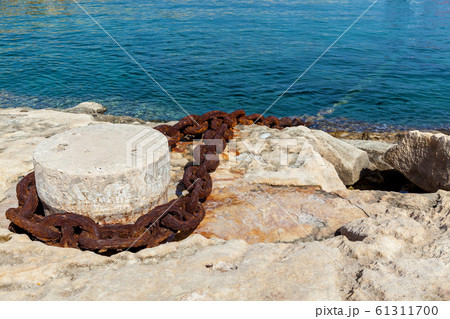 A metal chain attached to the bollard at port A metal chain attached to the bollard at port 61311700