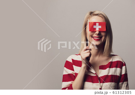 girl holds Switzerland flag on gray background girl holds Switzerland flag on gray background 61312305