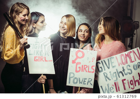 smiling happy feminists women together in smoky space 61312769