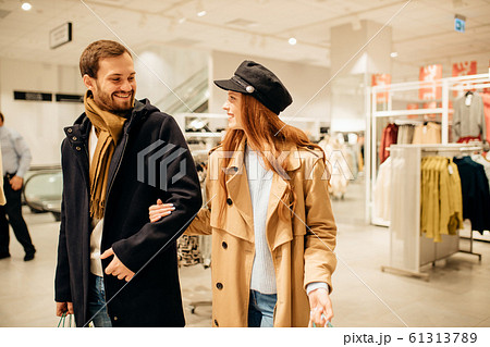 good-looking couple walking in clothes store good-looking couple walking in clothes store 61313789