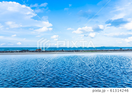 Beautiful outdoor swimming pool in hotel resort with white cloud and blue sky for leisure relax Beautiful outdoor swimming pool in hotel resort with white cloud and blue sky for leisure relax 61314246