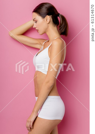 side view on thin and slim woman with sportive body isolated 61314670
