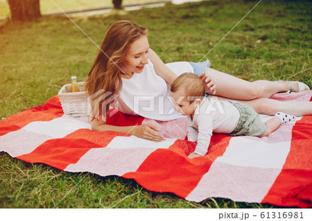 Mom and son relax in the park. 61316981