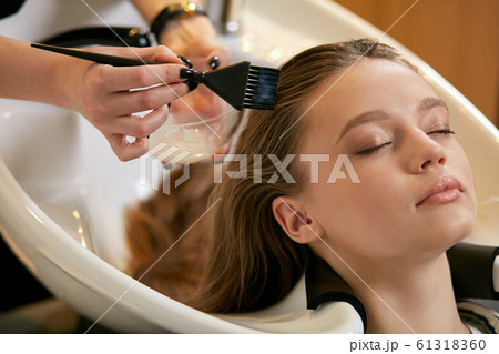 professional hairdresser in beauty saloon with clients 61318360
