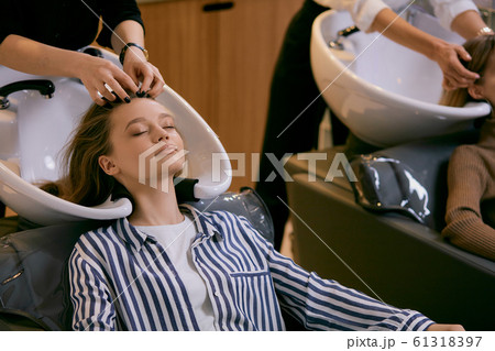 young caucasian girls came in beauty saloon for changing colour of hair 61318397