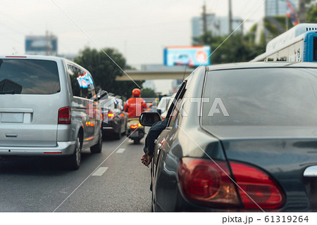 Cars on busy road in the city with traffic jam Cars on busy road in the city with traffic jam 61319264