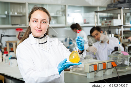 Female student examining chemical substances Female student examining chemical substances 61320397