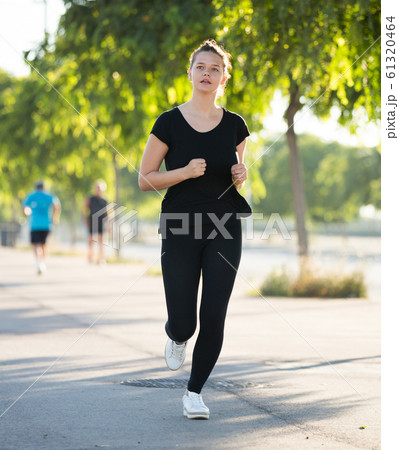 Girl jogging during outdoor workout 61320464