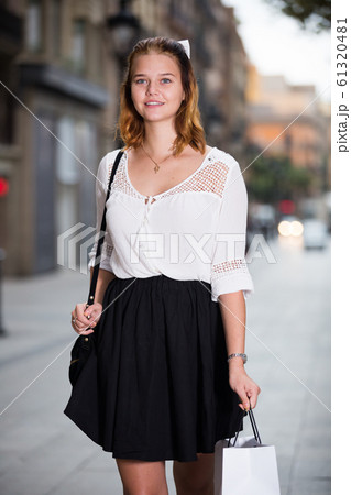 positive female walking at the modern street 61320481