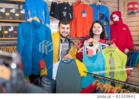 Positive couple boasting sportswear items 61320641