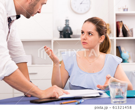 Woman is reading a marriage contract at the table Woman is reading a marriage contract at the table 61321458