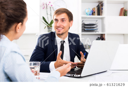 Man manager sitting and working on computer 61321629