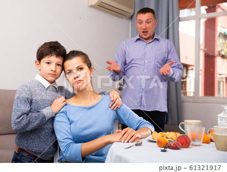 Ordinary family with teen son having quarrel at home 61321917