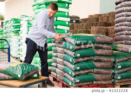 Customer buying fertilizer in store Customer buying fertilizer in store 61322228