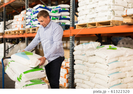 Man choosing materials for home renovation Man choosing materials for home renovation 61322320
