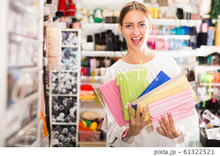 Delighted woman with ribbons 61322521